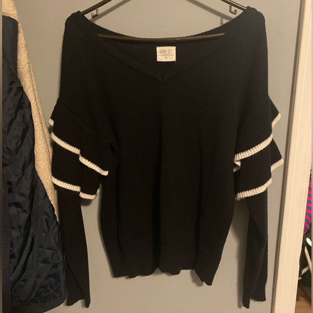 Black sweater with ruffles on sleeves